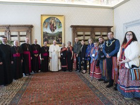 Pope Francis posing with an Indigenous delegation on Monday including Canada's Metis National Council President, Cassidy Caron, who is sixth from the right.