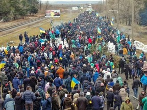 A crowd of Ukrainian civilians blocking a road in Enerhodar, March 2, 2022.