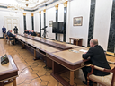 Russian President Vladimir Putin chairs a meeting on economic issues at the Kremlin in Moscow on February 28, 2022. The immense table, present at all of Putin's recent meetings, is reportedly to protect his health. 
