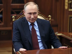 Russian President Vladimir Putin attends a meeting with the head of Russia's Union of Industrialists and Entrepreneurs, a big business lobby group, at the Kremlin in Moscow on March 2, 2022. (Photo by Mikhail Klimentyev / SPUTNIK / AFP)