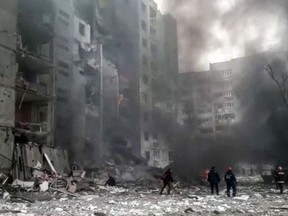 This grab made from a handout video released by the State Emergency Service of Ukraine, shows a damaged apartment building which is said was hit by shelling in Chernihiv on March 3, 2022. – Nine people died and four were injured after Russian forces hit residential areas, including schools, in the northern Ukrainian city of Chernihiv, the local governor said on March 3.