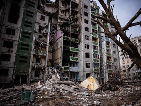 This picture taken on March 4, 2022 shows a residential building damaged during a shelling the day before in the city of Chernihiv. - Forty-seven people died on March 3 when Russian forces hit the residential areas, including schools and a high-rise apartment building, in the northern Ukrainian city of Chernihiv, officials said.