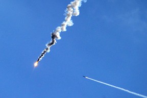 An air defence system missile flies towards a mock enemy target during the joint Russian-Belarusian military exercises Zapad-2017 at a training ground near the village of Volka, some 200 km southwest of Minsk, on Sept. 19, 2017.