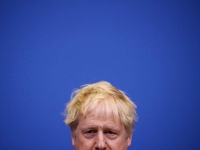 Britain's Prime Minister Boris Johnson on March 24, 2022. (Photo by HENRY NICHOLLS / POOL / AFP)