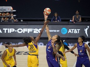 Brittney Griner controls the opening tipoff during a WNBA basketball game, July 25, 2020. (AP Photo/Phelan M. Ebenhack)
