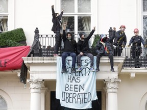 People protested the invasion of Ukraine occupying a mansion, reportedly owned by members of billionaire Oleg Deripaska's family, in London, U.K., on Monday, March 14, 2022. The group plan to remain in the property until the war is over and all of the refugees have been housed, one of the protesters said.
