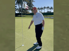 Former U.S. president Donald Trump points to the ball after hitting a hole-in-one during a recent golf game.