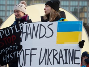 Demonstrators protest the Russian invasion of Ukraine at Toronto City Hall on Feb. 24, 2022.