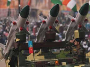 In this file photo taken on January 26, 2022 a soldier salutes next to an Akash missile system during India's 73rd Republic Day parade at the Rajpath in New Delhi. India's military accidentally fired a missile into Pakistan, New Delhi's defence ministry said on March 11, calling it "deeply regrettable."