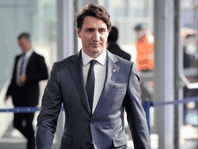 Prime Minister Justin Trudeau arrives ahead of a NATO summit at NATO headquarters in Brussels on March 24, 2022.