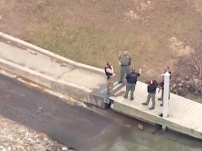 Authorities at the scene of a shooting that left a man dead after he was rescued from a lake in South Carolina.