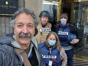 Fox News cameraman Pierre Zakrzewski, who was killed in Ukraine after the vehicle in which he was traveling was struck by incoming fire, poses for a selfie with colleagues Steve Harrigan, Yonat Frilling and Ibrahim Hazboun in Kyiv, Ukraine in an undated photograph. FOX News Sunday/Handout via REUTERS.