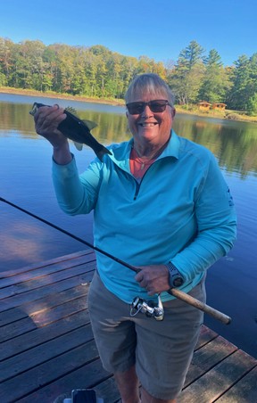 Marlene Keranen happily shows off her catch during her stay at the Seguin Valley Golf Club.