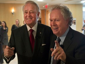 Former prime minister Brian Mulroney, left, arrives with former Quebec premier Jean Charest at a tribute for Claude Ryan on Feb. 14, 2014, in Montreal. Letter writer and former MP Charles J. Mayer, who served in Mulroney's cabinet, argues that Jean Charest, also a Mulroney cabinet minister, represents modern Conservative values.