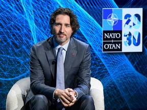 Prime Minister Justin Trudeau participates in a discussion at a NATO Summit in Brussels in 2021.