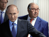 Russian President Vladimir Putin and billionaire businessman Alisher Usmanov, right, on July 14, 2017.