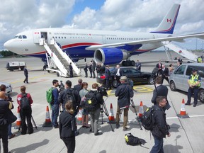 Journalists wait for the prime minister to disembark from RCAF 01, the Airbus CC-150 Polaris used to carry the prime minister, in 2013.