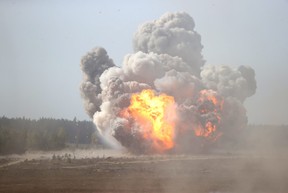An explosion is seen during the military exercise Zapad-2021 staged by the the armed forces of Russia and Belarus at the Obuz-Lesnovsky training ground, Belarus, Sept. 12, 2021.
