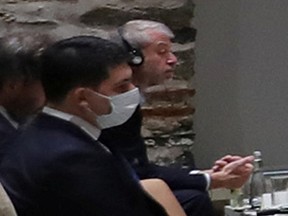 Russian billionaire Roman Abramovich listens as Turkish President Tayyip Erdogan (not seen) addresses Russian and Ukrainian negotiators before their face-to-face talks in Istanbul, Turkey March 29, 2022.