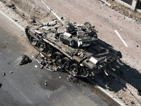 A charred Russian tank is seen in the Kyiv region of Ukraine, March 20, 2022.
