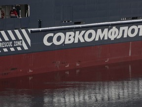 The logo of Russian state shipping company Sovcomflot is seen on the multifunctional icebreaking standby vessel "Yevgeny Primakov" moored in central St. Petersburg, Russia on Feb. 3, 2018.