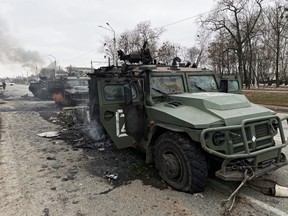 Destroyed Russian all-terrain Tigr-M vehicles  are seen on a road in Kharkiv, Ukraine, on Feb. 28.