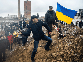 Civilians train to throw Molotov cocktails to defend the city, as Russia's invasion of Ukraine continues, in Zhytomyr, Ukraine March 1, 2022.