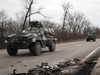 Ukrainian army vehicles pass by burned debris on March 5, 2022 in Sytniaky, Ukraine.