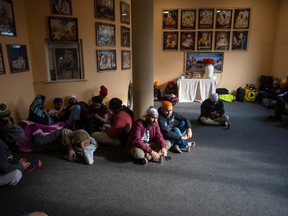 Refugees gather in the reception area at the Gurdwara Sri Guru Singh Sabha temple in the suburbs of Warsaw.