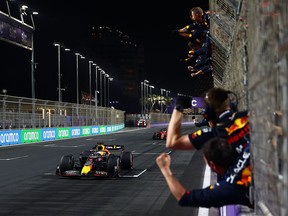 Race winner Max Verstappen of the Netherlands is cheered as he passes his crew during the F1 Grand Prix of Saudi Arabia at the Jeddah Corniche Circuit on March 27, 2022, in Jeddah, Saudi Arabia. Sabrina Maddeaux argues that the Formula 1 race league should not be "sportswashing" the reputations of authoritarian states and criminals.