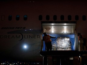 A Warsaw bound cargo plane is loaded with humanitarian aid, including medical supplies destined for Ukraine, at Pearson International Airport.