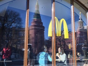 People have a lunch a McDonald's restaurant next to the Kremlin in Moscow on March 10, 2022.