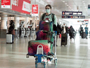 Passengers at the nearly empty departure level of Trudeau International Airport in Montreal on December 17, 2021.