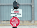 A sign at the entrance to a turkey farm in Ontario's Oxford County in 2015 notifies visitors of enhanced biosecurity measures following an outbreak of bird flu. A new strain of bird flu has been found at three southern Ontario farms.