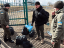 Men from Estonia prepare to cross the border from Poland to Ukraine to help fight the Russian invasion, March 10, 2022.