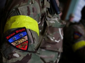 A foreign fighter — identified as a member of the U.K.'s Norman Brigade — departs for the front line, at the main train station in Lviv, Ukraine, March 5, 2022. At least 550 Canadians are similarly in Ukraine to fight Russian troops.