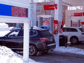 Motorists fill up at a gas station in Montreal on March 3, 2022.