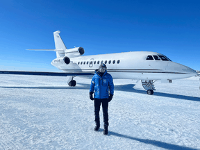 Russian billionaire Vasily Shakhnovsky poses in front of the Dassault Falcon 900 plane that was detained in Canada this week, during a previous trip to Antarctica.
