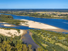 Just like sand can block water in a river, large particles can block the flow of air through filters.