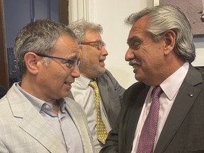 Avi Benlolo, left, meets Argentinian President Alberto Fernández, right, in Buenos Aires.
