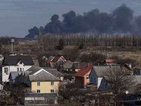 Thick black smoke rising into the sky is seen from the village of Kalynivka, as Russia's invasion of Ukraine continues, outside Kyiv, Ukraine.