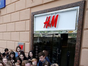 People queue outside the Swedish fashion retailer Hennes & Mauritz (H&M) store on its opening day in central Moscow, Russia, in May 2017.