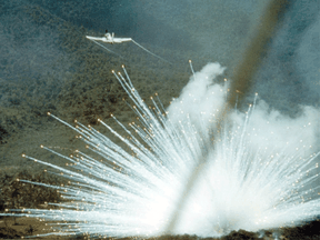 A U.S, Air Force plane drops a 100-pound white phosphorus bomb on a Viet Cong position in South Vietnam in 1966.