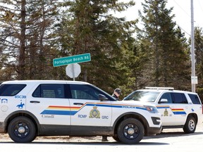 RCMP cars block the entrance to Portapique Beach Road after officers finished their search for Gabriel Wortman, on April 19, 2020.