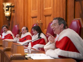 Canada's Supreme Court Justice Nicholas Kasirer gestures as he speaks during his official welcome ceremony in the courtroom of the Supreme Court of Canada, in Ottawa on November 4, 2019. THE CANADIAN PRESS/Chris Helgren-Pool