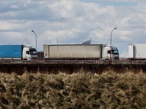 Trucks wait in line on the Queen Victoria bridge to enter the country on April 16, 2022 in Panemune, Lithuania.