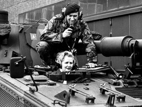 Margaret Thatcher, then chairwoman of the British Conservative Party, sits in a tank of the 7th regiment of the Royal Signals in Herford, West Germany, in 1976.