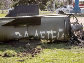 The remains of a large rocket with the words "for our children" in Russian is pictured next to the main building of a train station in Kramatorsk, that was hit by a rocket attack killing at least 35 people, on April 8, 2022.
