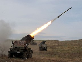 A Ukrainian multiple rocket launcher BM-21 "Grad" shells Russian troops' position, near Lugansk, in the Donbas region, on April 10, 2022.