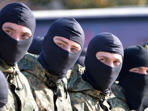 Servicemen in Ukraine's Azov Battalion attend an oath-taking ceremony in Kyiv before leaving to serve in the conflict-torn Lugansk and Donetsk regions, in an Oct. 19, 2014 file photo.